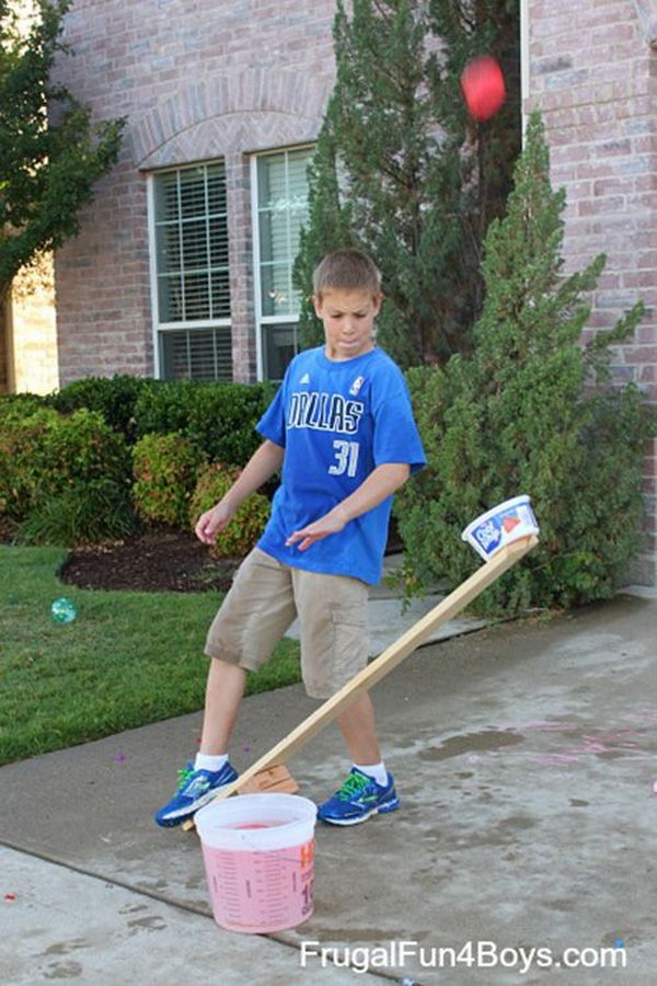 Wood Catapults Water Balloon Launcher. Use a screw to attach a plastic container to the end of to hold the water balloons. Stamp the other end of the catapult to launch the water balloon.