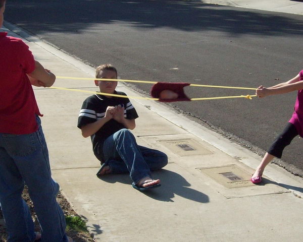 Water Balloon Launcher. Sew a long tube and another one for the handle. Run the tubing through and tie it in a triple knot at the ends. With two kids hold each end of the long tube and another kid aim and fire the water balloon with the handle.