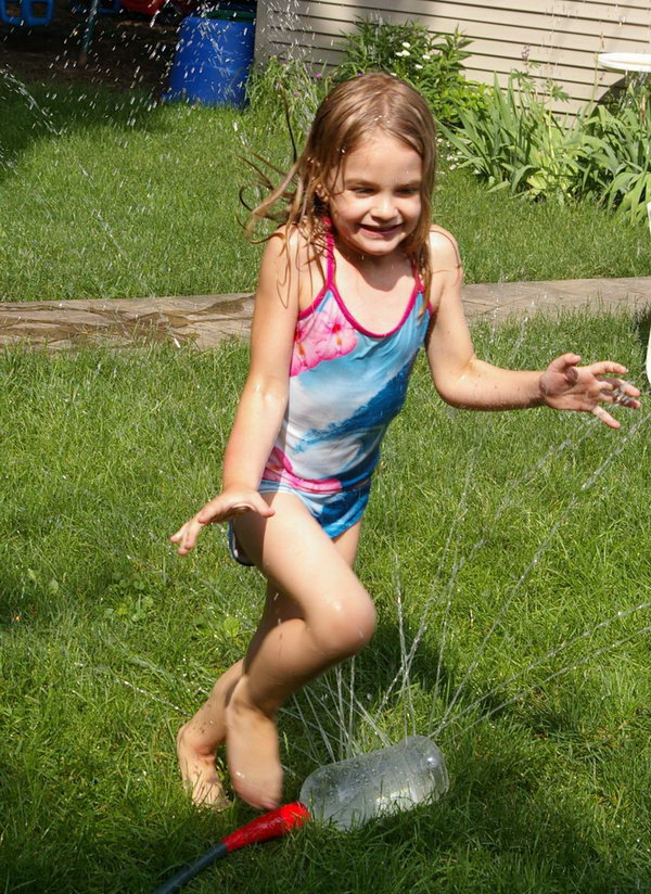  Water fun sprinkler. Simply attach the recycled large bottle with drilled holes all over to the garden hose and then the kids can enjoy great fun in summer to run and jump on it. 