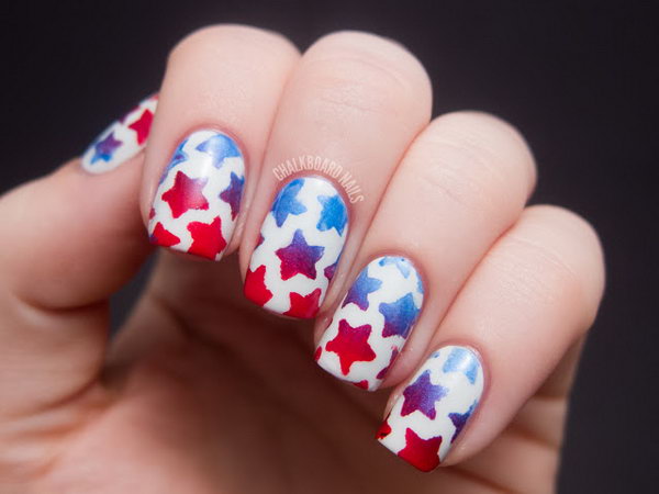  Stenciled Star Nail Art: This stenciled star design is a trendy take on flag-inspired nails. Start with a pearl white base. Then use stenciled stars to draw blue and white stars with a nail art brush! Have a look at the tutorial here.