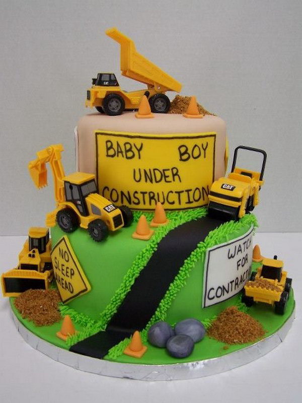  Cute Construction Cake: It's hard to imagine a little tractor lover not in fond of this beautiful cake with lots of trucks around. 