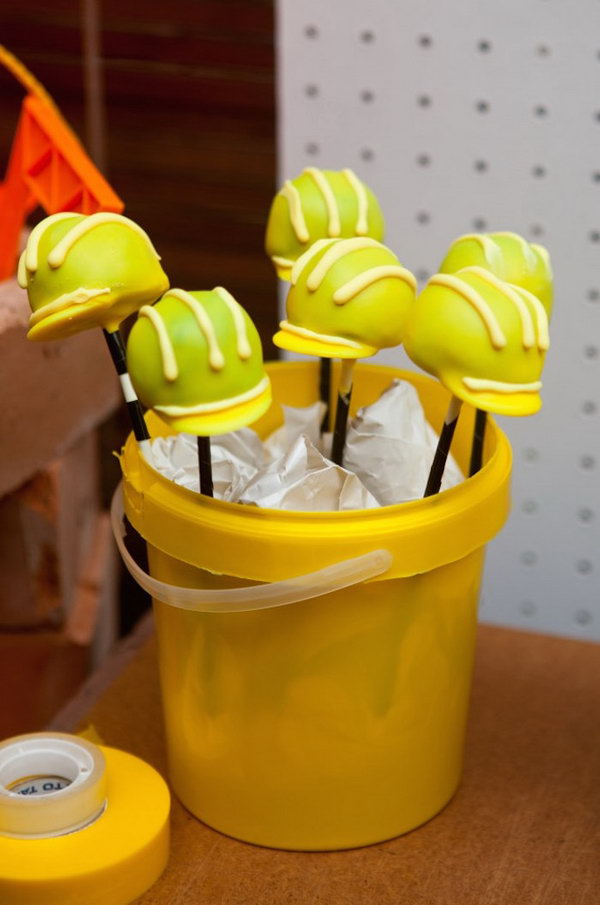  Cute Hard Helmet Cake Pops: What cute hard helmet cake pops. They really further the construction theme. 