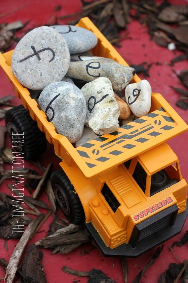 Truck Themed Birthday Party Activity: Learn the alphabet and practise spelling words using alphabet rocks in a construction site play activity! Lots of hands on fun and literacy learning for kids. 