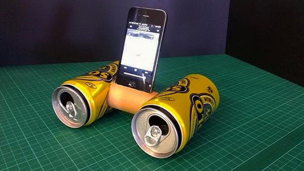 Recycled Trash Cans and Toilet Paper Roll iPhone Speaker: This little thing was made out of two drink cans and a toilet roll and it's really easy to recreate. Cut a hole in the sides of two soft drink cans big enough for a toilet roll to fit into. Cut a hole in the side of the toilet roll, secure it between the two cans. You will get a amplifier give your music extra volume and a crisper, cleaner sound. 