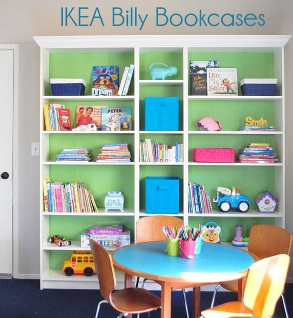 Beautiful IKEA  BILLY Bookcases for Kids. Good transformation by painting the backs in green and adding molding for the plain BILLY bookcase. This is perfect for the playroom! 