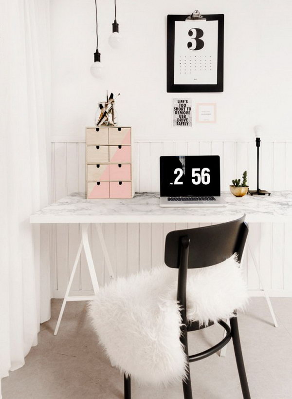 A Faux-Marble Desk. Another clever DIY desk. The tabletop with marble-printed paper, that is available in hardware stores or online, gives this simple IKEA desk a luxurious look. 
