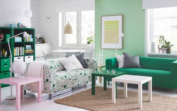 Living Room for Green Lovers. Here green is used in nearly a shocking fashion. Green book shelves, green sofas , green side table and light green painted-wall are featured in this living space. If you are a green lover, you can get some inspiration from this decor.