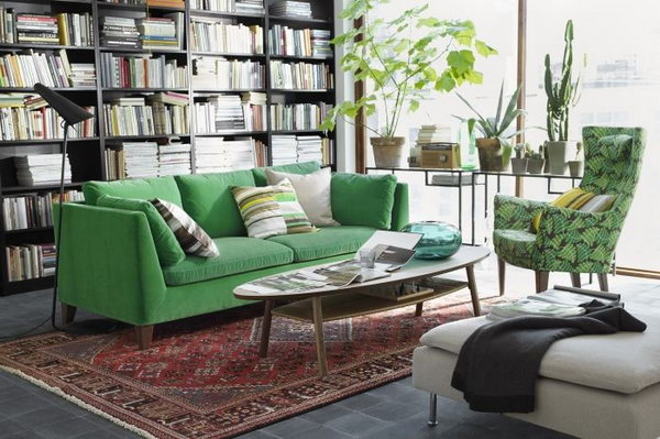 A Living Room Inspired by Nature. Loving the organic color schemes in this living room.  A comfy green sofa, leaf print chair and plenty of plants add a warm and homey feeling to this space.