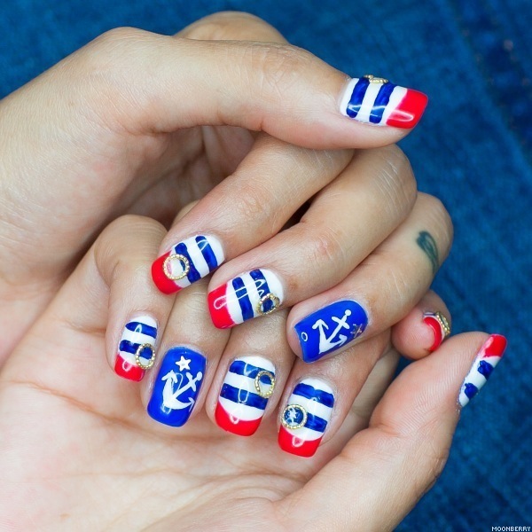  Patriotic Nautical Nail Art: The red blue and white stripes with an anchor accented nail design is so pretty. And the little golden rings added to the stripes plus a fancy look. Check out the tutorial  