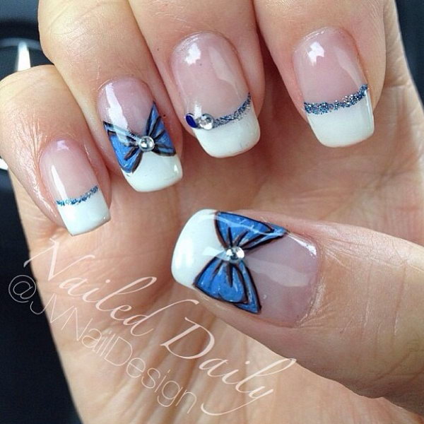 White Tips Nail Design with Blue Bows. 