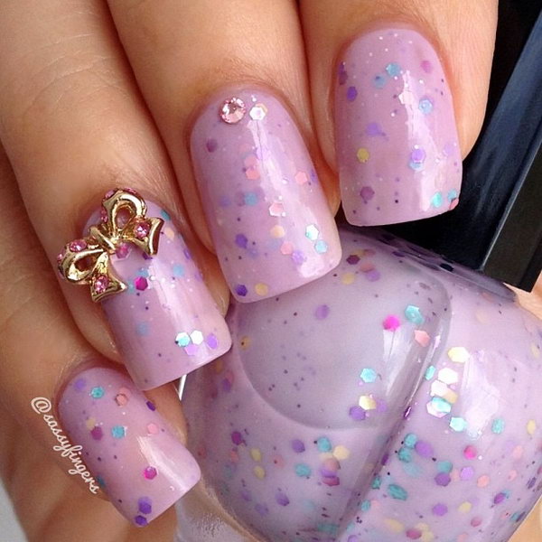 Pink and Sequined Nail with Gold Bows. 