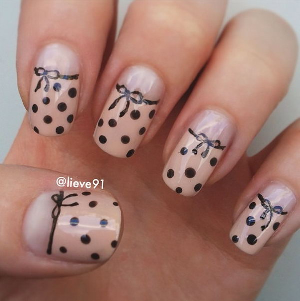 Girly Beige Nails with Black Dots and Bows. 