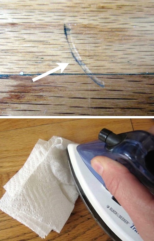 Use an iron and a wet cloth or paper towel to fix the dents in wood. 