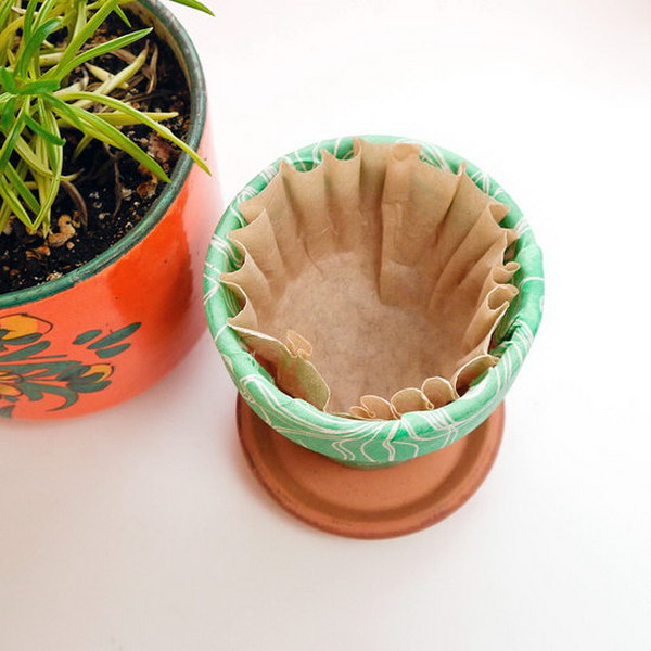 Use Coffee Filters to Retain Water and Soil in Your Pots 