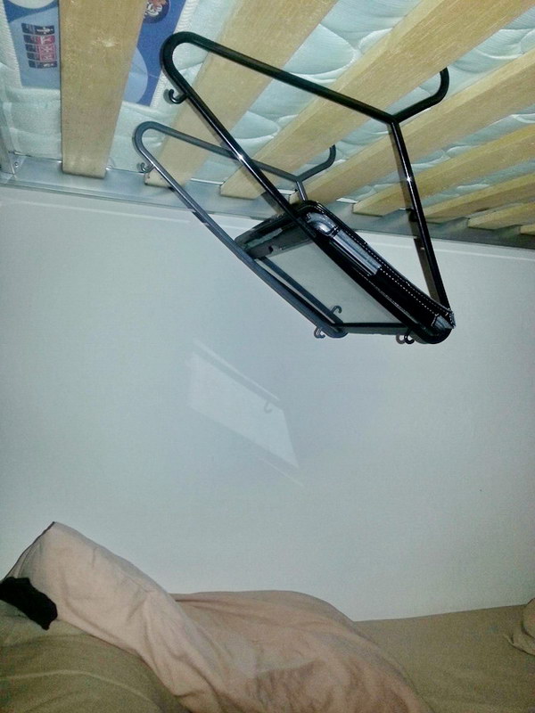 Suspend your tablet over your bed with coat hangers. 