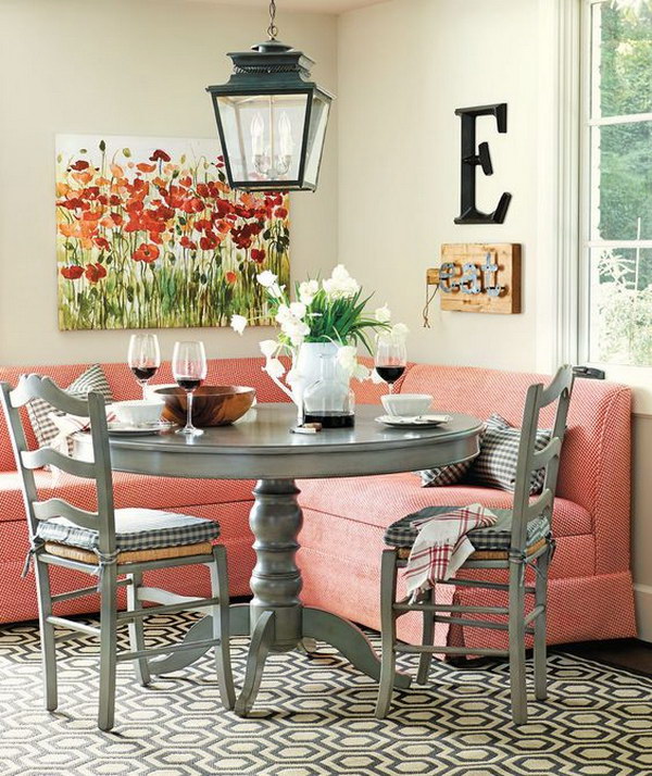 Stylish Breakfast Nook with Red Banquette Seating. 
