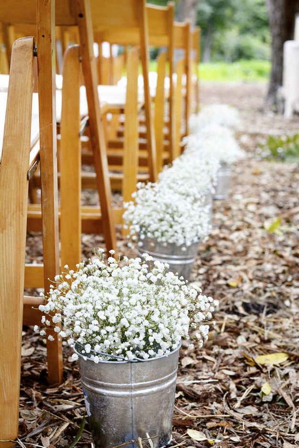 Tin Buckets Filled with Baby's Breath Lining the Ceremony Aisle 