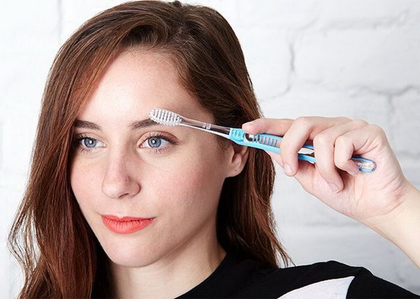 Tame Unruly Brows with Toothbrush. 