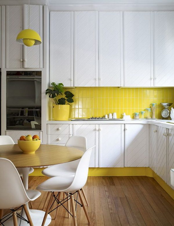 Yellow Subway Tile Backsplash against the Sleek White Cabinets