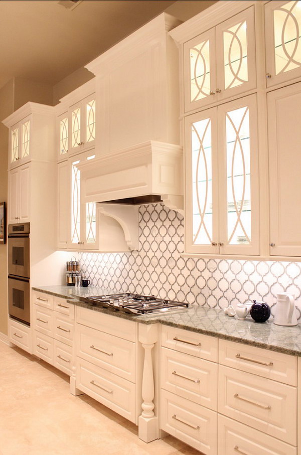 Stunning Calcutta Gold Marble and Grey Glass Backsplash with Beautiful White Cabinetry 