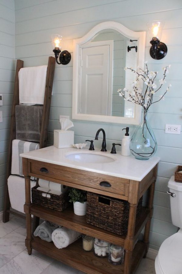 The ladder towel rack and the woven baskets give this beautiful bathroom a rustic feel. 