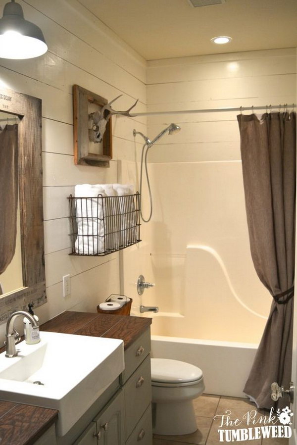 Rustic Bathroom With Wire Towel Basket Over The Toilet. 