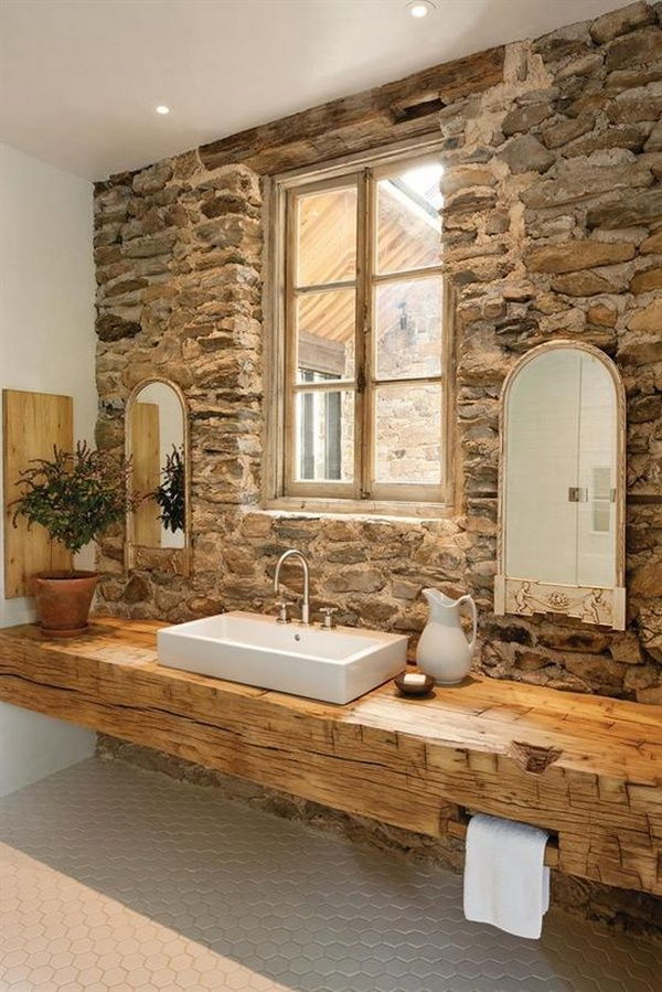 Rustic Bathrooms With Stone Walls And Wooden Wall Mounted Vanity 