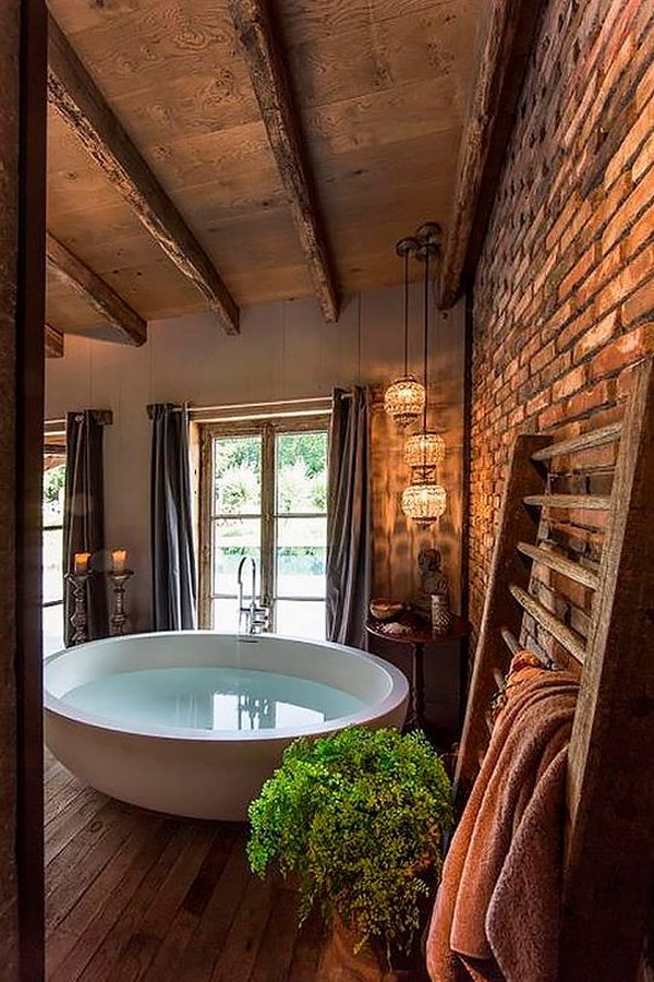  Barn Wood Flooring And Ceiling,  Exposed Brick Wall, Round Bathtub In A Great Rustic Bathroom 