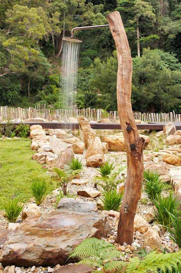Cool Outdoor Shower With Golden Chrome Pipe Inside Tree Log. 