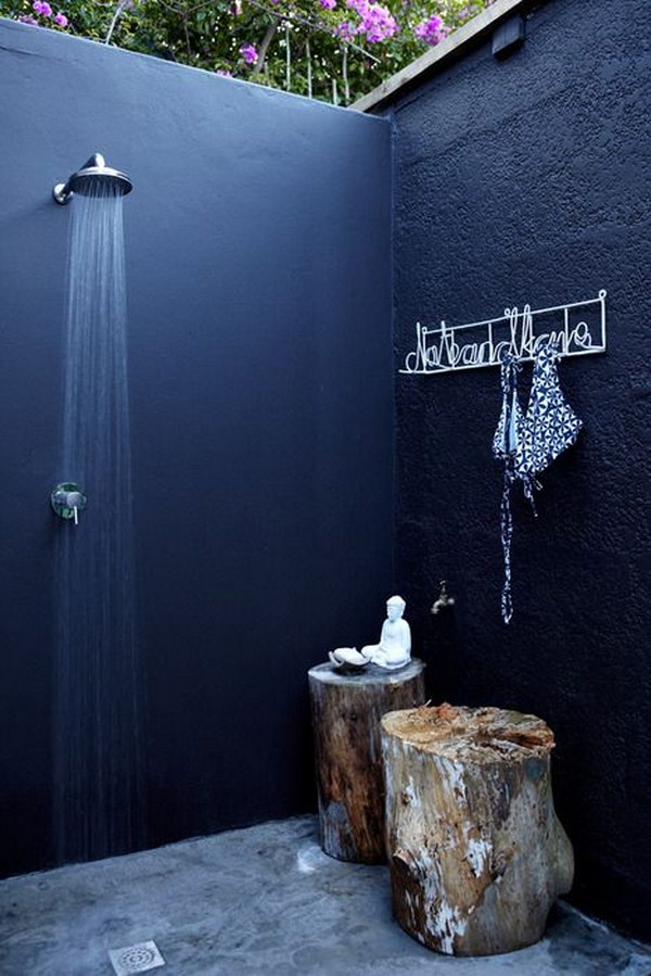 Cool And Relaxing Outdoor Shower with Tree Stump Stools. 