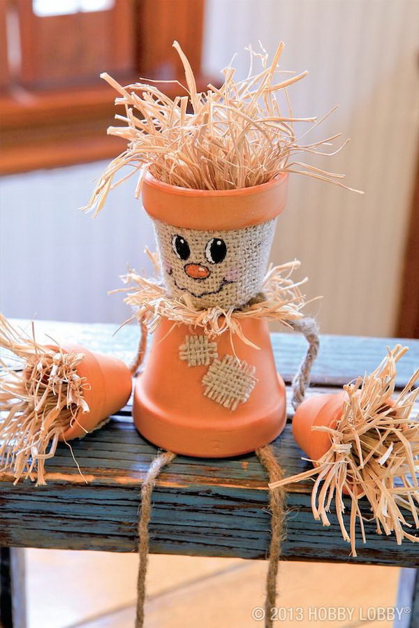 Turn Flower Pots Into Scarecrows . 