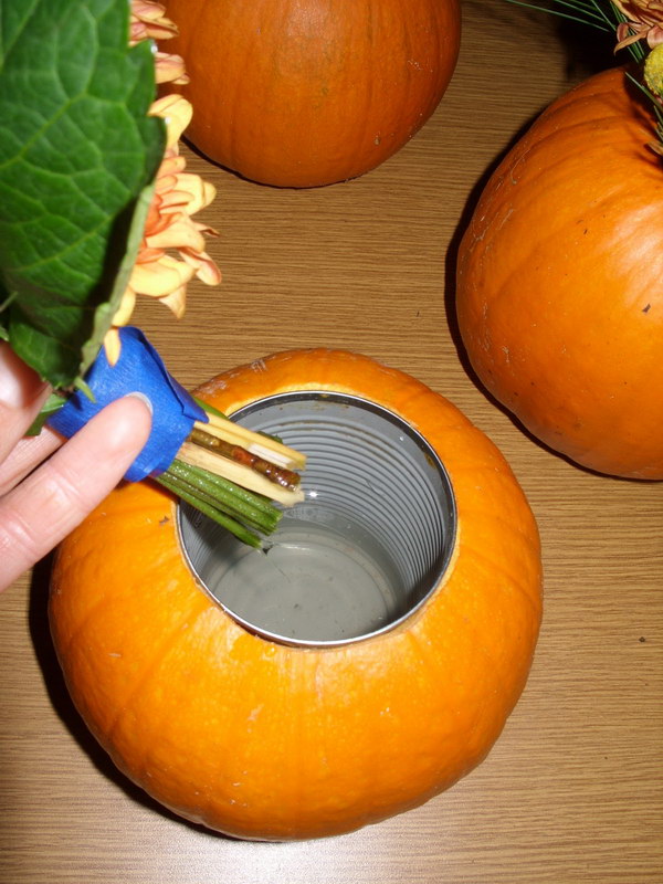 Carve Out A Pumpkin And Place A Metal Can For Flower Arrangement. 