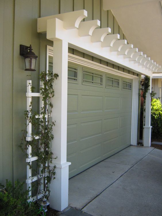 Add Character to the Garage with Arbor Painted to Match House Trim. 