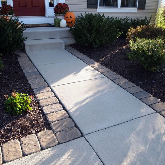 Dress up a Standard Entry by Lining Pavers along the Walkway. 