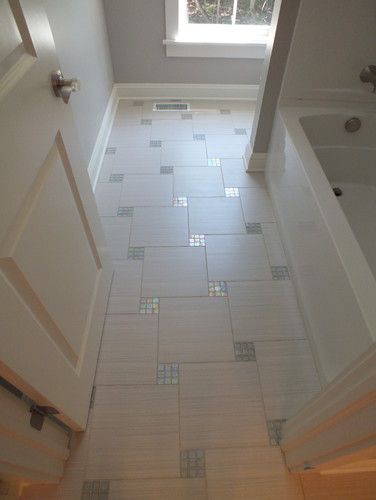 Bathroom Floor With Mosaic Inlays. 