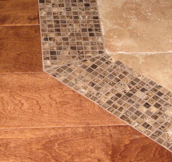 Use Smaller Tiles as a Threshold to Transition From Tile to Wood. 