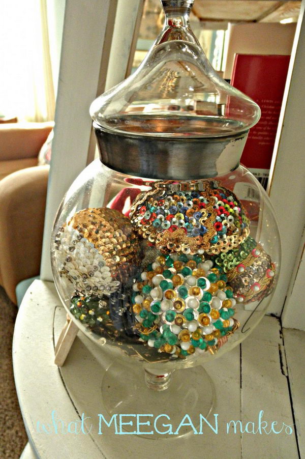Christmas Decoration With Sequin Ornaments Placed In An Apothecary Jar. 