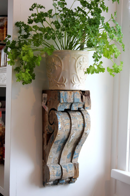 Wall Shelves Made From Old Wood Corbels For Holding Herbs. 