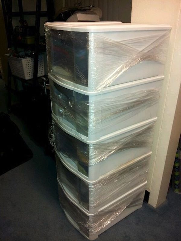 Use Plastic Wrap for Moving Storage Bins. 