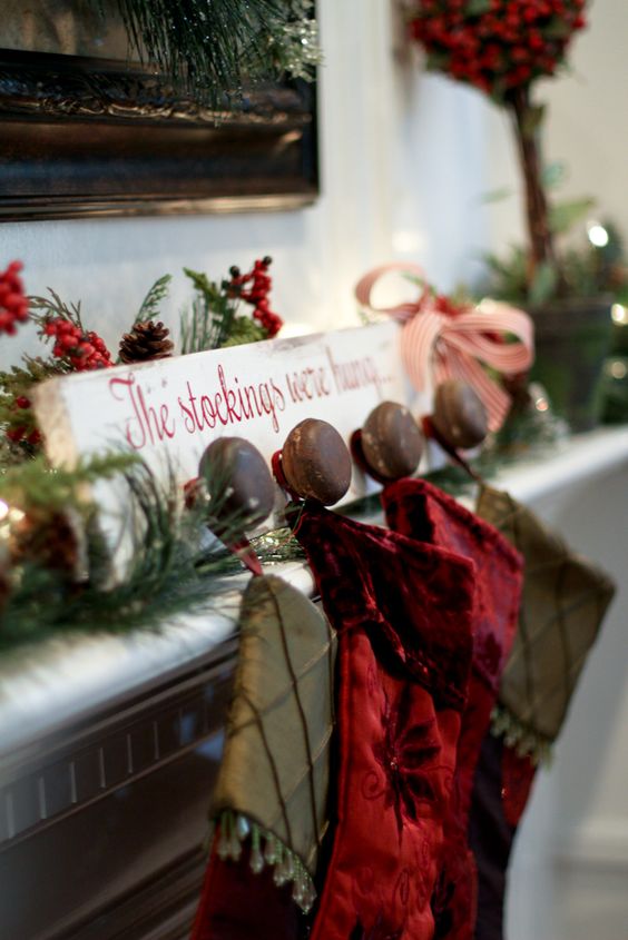 White Wood With The Red Writing DIY Stocking Holder. 
