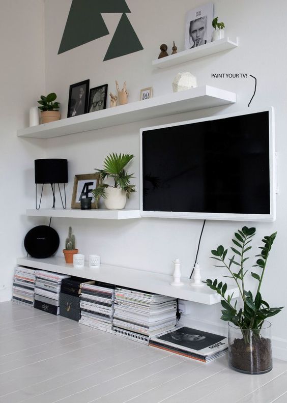 Mix TV in with Lack Ikea Shelving. 