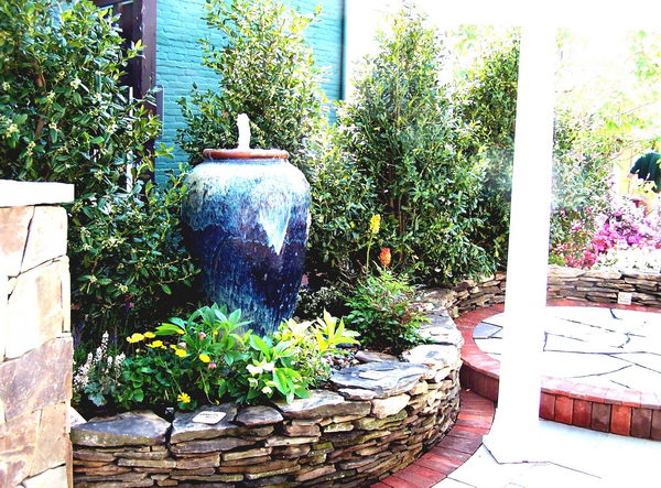 Front Yard Landscape Design With Tall Vase Fountain. 