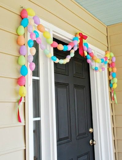 Front Door With Easter Egg Garland. 